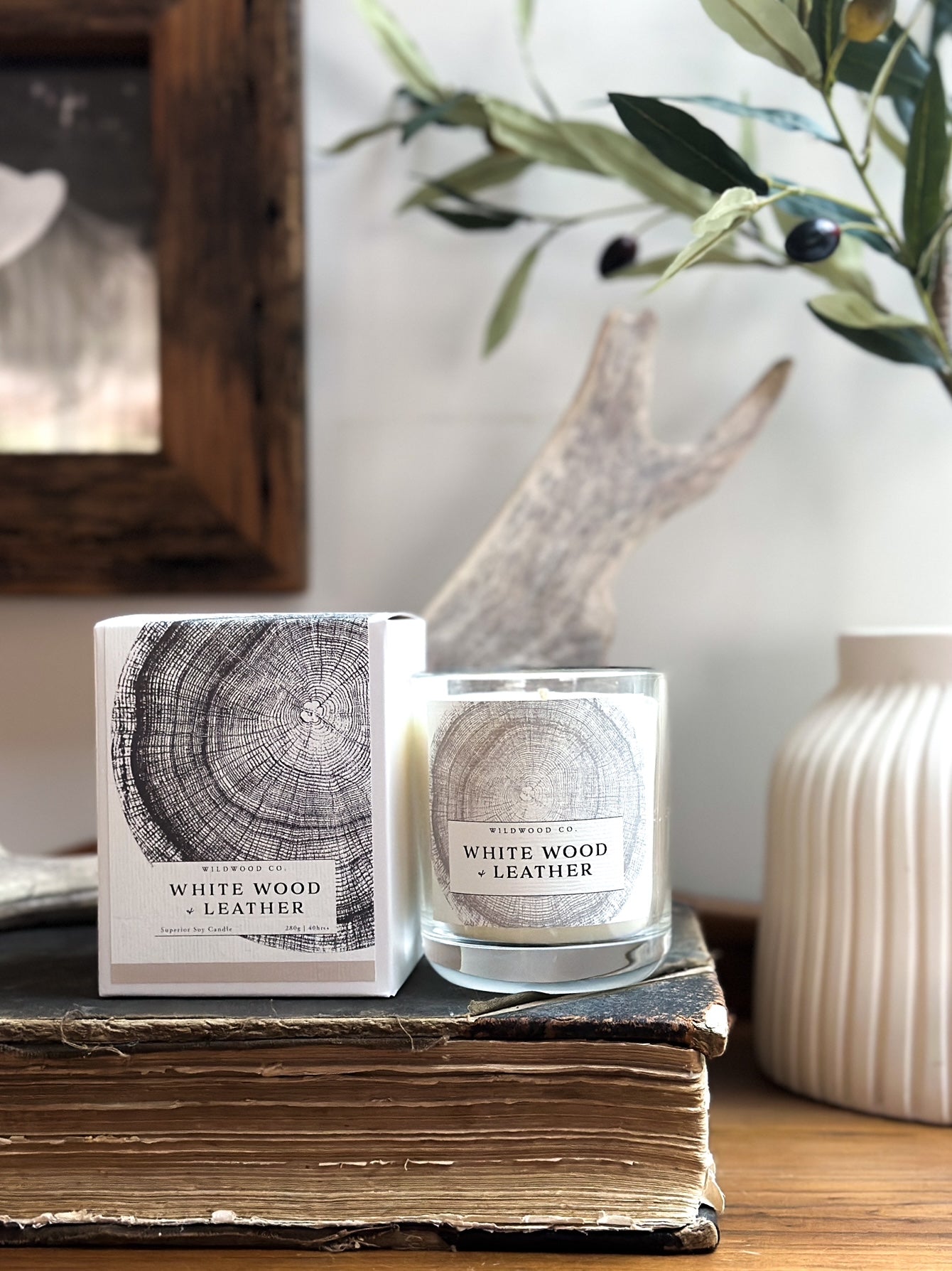 White Wood and Leather Candle On Book. triple scented candle.
