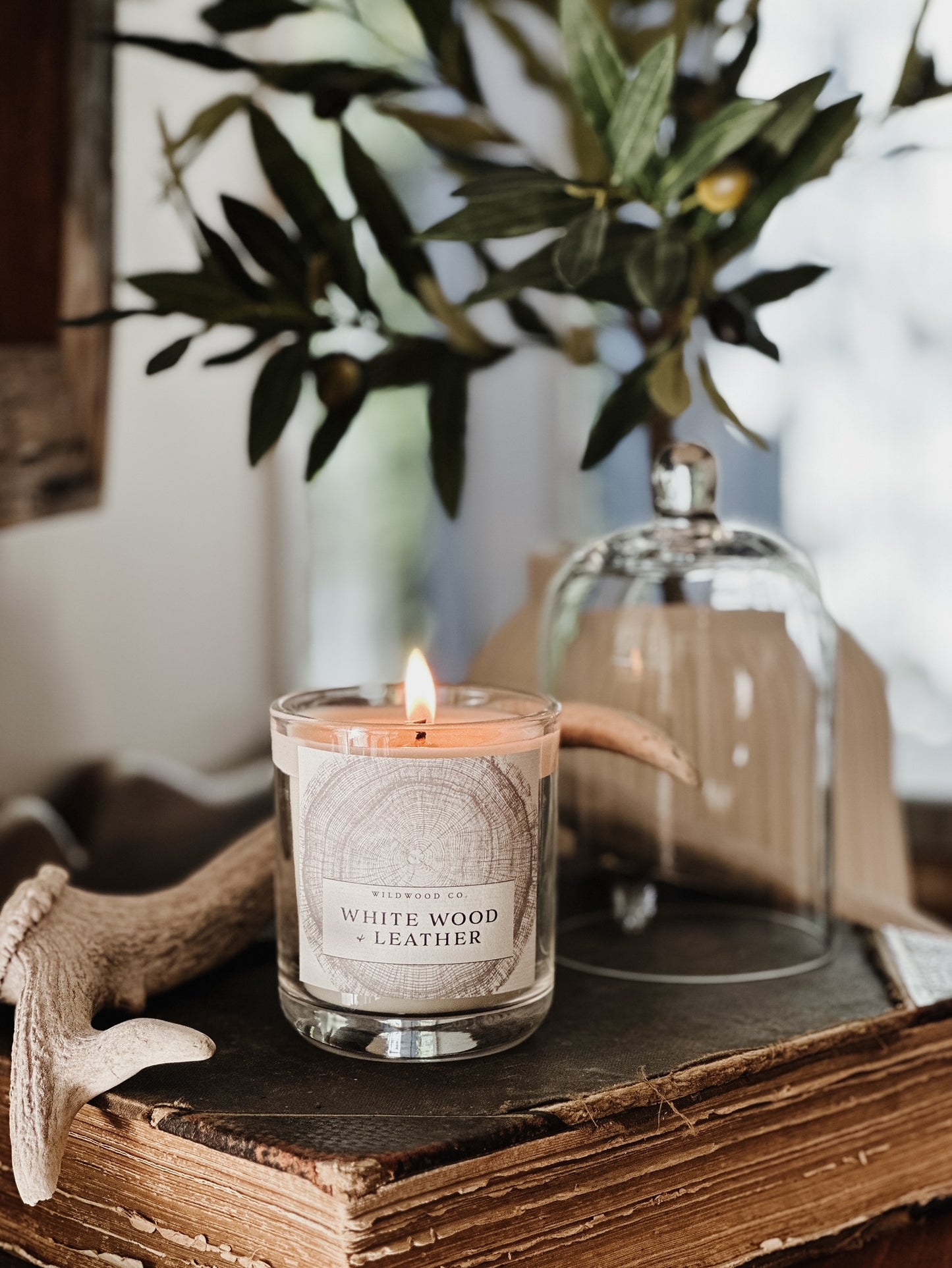 White Wood and leather candle front book